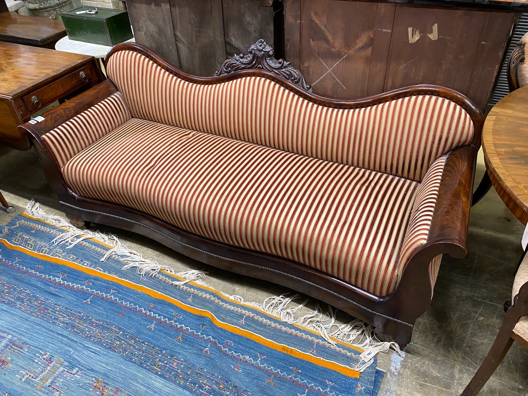 A 19th century Continental carved mahogany framed serpentine settee, length 190cm, depth 62cm, height 88cm